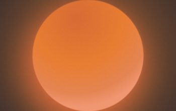 Wallpaper A Very Bright Orange Sun in the Sky