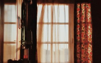 Wallpaper A Window with Curtains and a Sink