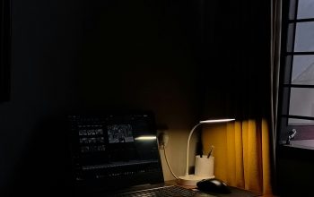 Wallpaper A Desk with a Lamp and a Telephone