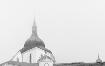 Wallpaper A Black and White Church on a Hill