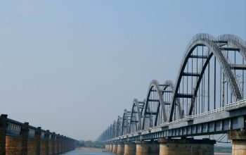 Wallpaper A Long Bridge Over a Large Body of Water
