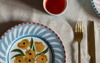 Wallpaper A Table Topped with Plates and Cups Filled with Food