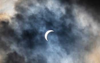 Wallpaper The Moon Through Cloudy Sky