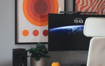 Wallpaper A Desk with a Computer Monitor and Speakers