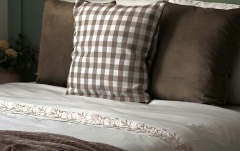 Wallpaper A Bed with Pillows and a Blanket