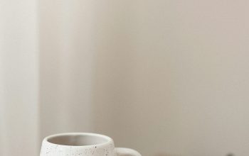 Wallpaper A White Coffee Cup on Wooden Table