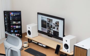 Wallpaper Modern Desk Setup with a Monitor and Two Screens