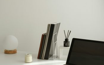 Wallpaper A Minimal Desk Setup with a Laptop and Accessories